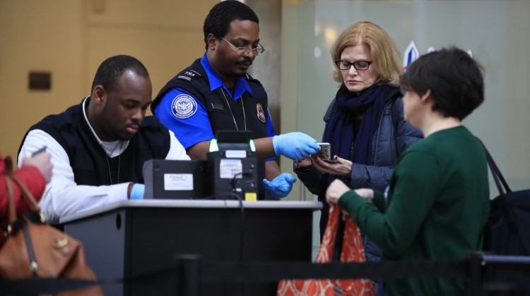 Transportation Security Administration workers screen airline passengers after a 35-day federal shutdown in 2018 and 2019 at Reagan Washington National Airport in Washington, Monday, Jan. 28, 2019. - Manuel Balce Ceneta / AP Photo