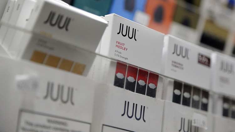 FILE - In this Dec. 20, 2018, file photo Juul products are displayed at a smoke shop in New York. Indianapolis Public Schools is one of hundreds of U.S. school districts, including 10 others in Indiana, that have signed on to a lawsuit against Juul Labs Inc. - AP Photo/Seth Wenig, File