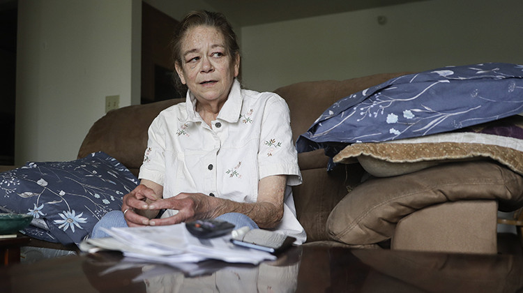 Leesa Huddleston talks about washing dishes and cleaning kitchens at a casino from her home, Monday, Aug. 3, 2020, in Shelbyville, Ind.  - AP Photo/Darron Cummings