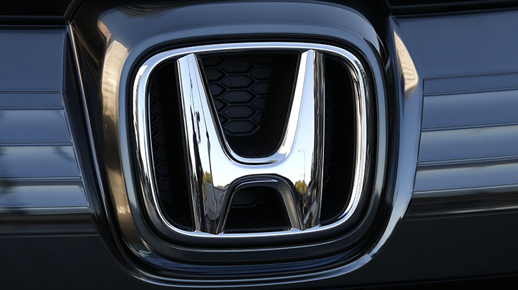 FILE - In this Jan. 11, 2016, file photo, the logo of Honda Motor Co. is seen on a Honda vehicle at the Japanese automaker's headquarters in Tokyo. Honda, on Tuesday, Aug. 4, 2020, is recalling over 1.6 million minivans and SUVs in the U.S. to fix problems that include faulty backup camera displays, malfunctioning dashboard lights and sliding doors that don’t latch properly. They cover certain Odyssey minivans from 2018 to 2020, Pilot SUVs from 2019 through 2021 and Passport SUVs from - AP Photo/Shuji Kajiyama, File