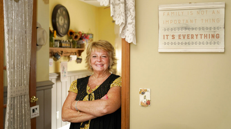 Kay Orzechowicz poses Wednesday, Sept. 2, 2020, for a portrait at her Griffith, Ind., home. After 35 years of teaching, Orzechowicz said COVID-19 "pushed her over the edge" to retire from northwest Indiana's Griffith High School at the end of July. Turning 58 in October, Orzechowicz had hoped to keep teaching for a few more years before retiring from the classroom. But after the pandemic intensified in March, the English teacher said her concerns about holding out mounted.  - AP Photo/Charles Rex Arbogast