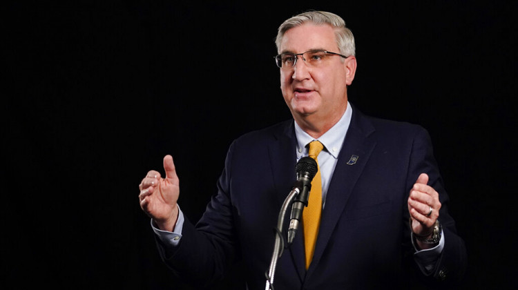 Indiana Republican Gov. Eric Holcomb participates in the Indiana Gubernatorial debate with Democrat Woody Myers and Libertarian Donald Rainwater, Tuesday, Oct. 27, 2020, in Indianapolis. The candidates were in separate studios to allow for social distancing guidelines. - AP Photo/Darron Cummings