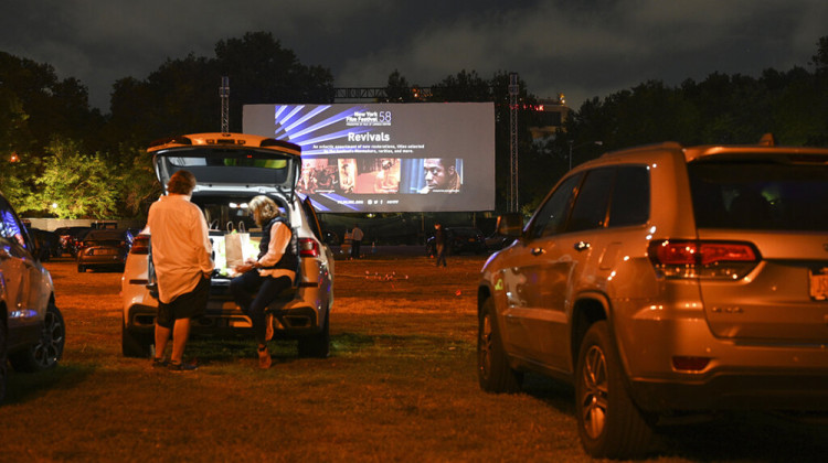 FILE - Filmgoers attend the "Nomadland" screening at the Queens Drive-In at the New York Hall of Science during the 58th New York Film Festival in New York on Sept. 26, 2020. After a historic season, winter is coming at the drive-in. Summer and early fall have seen the old drive-in transformed into a surprisingly elastic omnibus of pandemic-era gathering. Red-carpet premieres that would normally consume Lincoln Center uprooted to drive-ins.  - Evan Agostini/Invision/AP, File