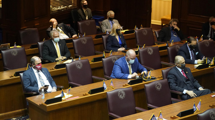 Lawmakers on the House floor for the ceremonial beginning of session were spaced out and wearing masks. - Darron Cummings/Associated Press