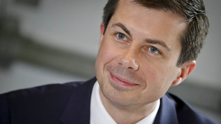 FILE - In this April 29, 2019 file photo, then Democratic presidential candidate Mayor Pete Buttigieg, from South Bend, Indiana, listens during a lunch meeting with civil rights leader Rev. Al Sharpton at Sylvia's Restaurant in Harlem neighborhood of New York. - AP Photo/Bebeto Matthews, Pool