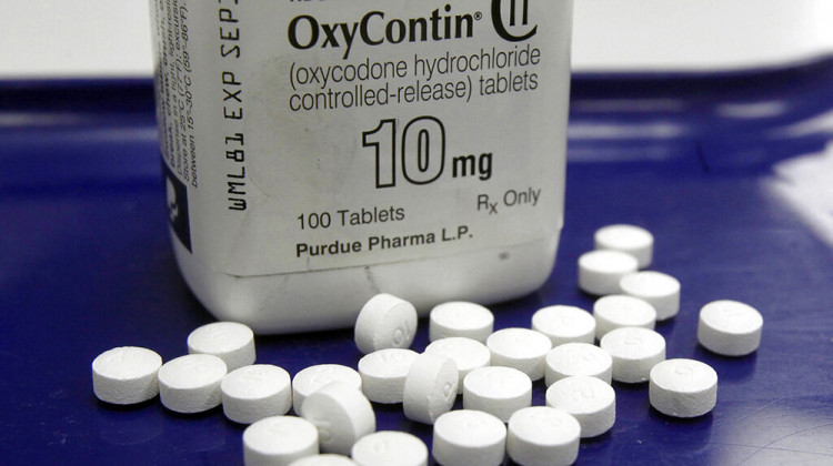 FILE - This Feb. 19, 2013, file photo shows OxyContin pills arranged for a photo at a pharmacy in Montpelier, Vt - AP Photo/Toby Talbot, File