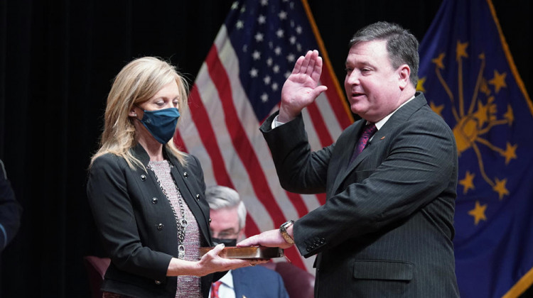 Todd Rokita, alongside his wife Kathy, is sworn in as Indiana's new attorney general.  - Darron Cummings/Associated Press