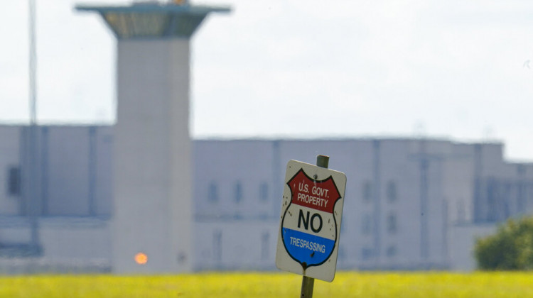 FILE - In this Aug. 26, 2020, file photo, the federal prison complex in Terre Haute, Ind. All federal prisons in the United States have been placed on lockdown, with officials aiming to quell any potential violence that could arise behind bars as law enforcement prepares for potentially violent protests across the country in the run-up to President-elect Joe Biden's inauguration on Wednesday. - AP Photo/Michael Conroy, File