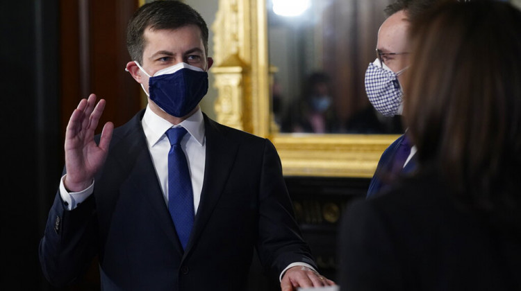 Pete Buttigieg, with his hand on the Bible held by Chasten Buttigieg, is sworn in as Transportation Secretary by Vice President Kamala Harris in the Old Executive Office Building in the White House complex in Washington, Wednesday, Feb. 3, 2021.  - AP Photo/Andrew Harnik