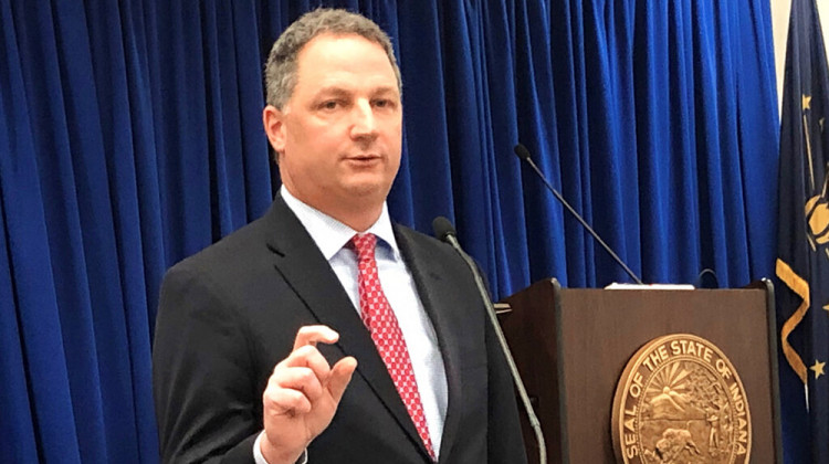 Indiana House Speaker Todd Huston speaks with reporters on Thursday, Feb. 4, 2021, at the Indiana Government Center in Indianapolis. Huston and other Republican leaders are supporting a proposal moving quickly through the Legislature to shield businesses and others from lawsuits by people blaming them for contracting COVID-19. - AP Photo/Tom Davies