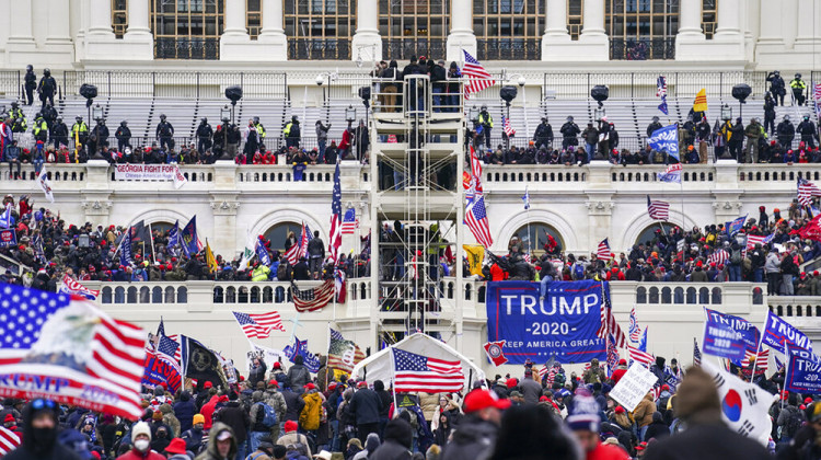 FILE - In this Jan. 6, 2021, file photo insurrectionists loyal to President Donald Trump breach the Capitol in Washington. Prosecutors secured the first guilty plea in the major case brought against members of the Oath Keepers extremist group in the attack on the U.S. Capitol, while an Indiana woman who became first person to be sentenced for the Jan. 6 riot avoided time behind bars. - AP Photo/John Minchillo