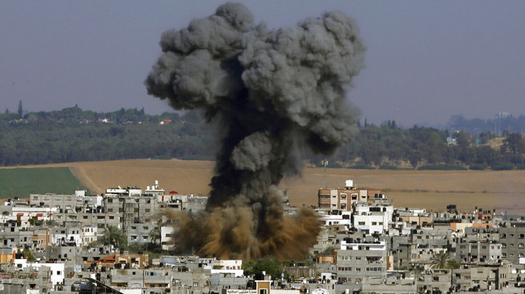 FILE - In this May 11, 2021, file photo, smoke rises after an Israeli airstrike in Gaza City. Israel is at war with Hamas, Jewish-Arab mob violence has erupted inside Israel, and the West Bank is experiencing its deadliest unrest in years.  - AP Photo/Hatem Moussa, File