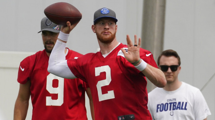 Indianapolis Colts quarterback Carson Wentz (2 ) throws as the team practiced at the NFL football team's facility, Thursday, May 27, 2021, in Indianapolis. - AP Photo/Darron Cummings