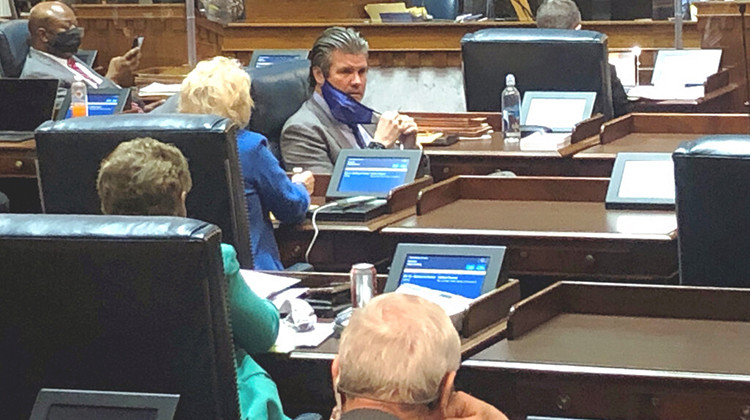 Indiana Senate Appropriations Committee Chairman Ryan Mishler, center speaks with a fellow senator during an April 1, 2021, Senate session at the Indiana Statehouse in Indianapolis. - AP Photo/Tom Davies