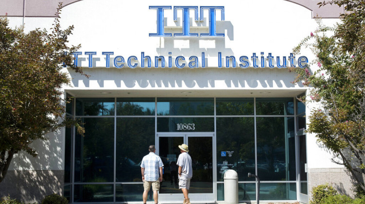 Students find the doors locked to the ITT Technical Institute campus in Rancho Cordova, Calif. The U.S. Education Department says it's erasing student debt for thousands of borrowers who attended a for-profit college chain that made exaggerated claims about its graduates' success in finding jobs. The Biden administration is approving 18,000 loan forgiveness claims from former students of ITT Technical Institute, a chain that closed in 2016. - (AP Photo/Rich Pedroncelli, File)