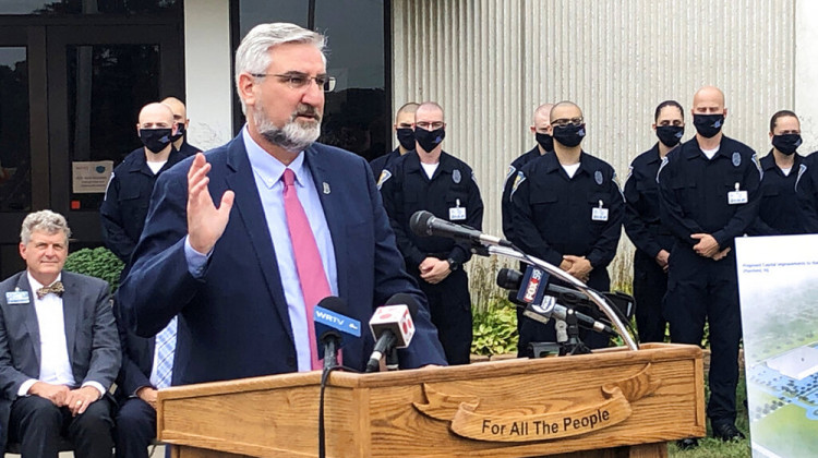 Indiana Gov. Eric Holcomb speaks during a bill signing ceremony at the Indiana Law Enforcement Academy in Plainfield, Ind., Monday, Aug. 16, 2021. Holcomb told reporters afterward that he supported the growing number of Indiana school districts issuing mask mandates for students and staff as they try to head off more COVID-19 outbreaks.  - AP Photo/Tom Davies