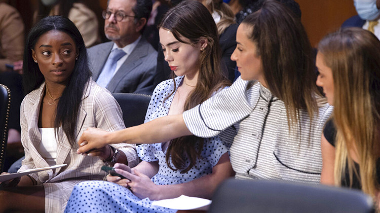 United States gymnasts from left, Simone Biles, McKayla Maroney, Aly Raisman and Maggie Nichols, arrive to testify during a Senate Judiciary hearing about the Inspector General's report on the FBI's handling of the Larry Nassar investigation on Capitol Hill, Wednesday, Sept. 15, 2021, in Washington.  - Saul Loeb/Pool via AP