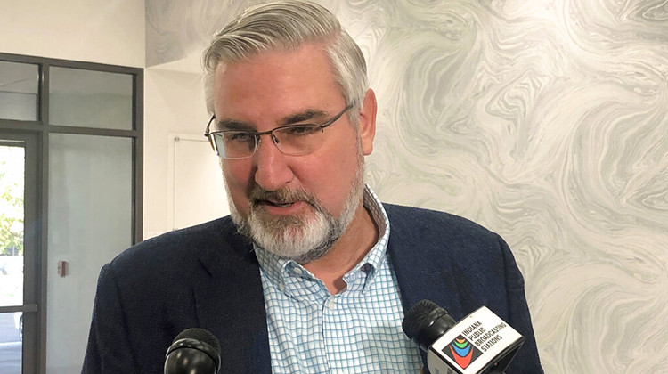 Indiana Gov. Eric Holcomb speaks with reporters during the Indiana Technology and Innovation Association conference in Fishers, Ind., on Friday, Oct. 8, 2021. Holcomb said he had not yet decided whether to appeal a court decision against his lawsuit challenging the expanded power state legislators gave themselves to intervene during public health emergencies. - AP Photo/Tom Davies