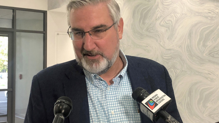 Indiana Gov. Eric Holcomb speaks with reporters during the Indiana Technology and Innovation Association conference in Fishers, Ind., on Friday, Oct. 8, 2021. Holcomb said he had not yet decided whether to appeal a court decision against his lawsuit challenging the expanded power state legislators gave themselves to intervene during public health emergencies. - (AP Photo/Tom Davies)