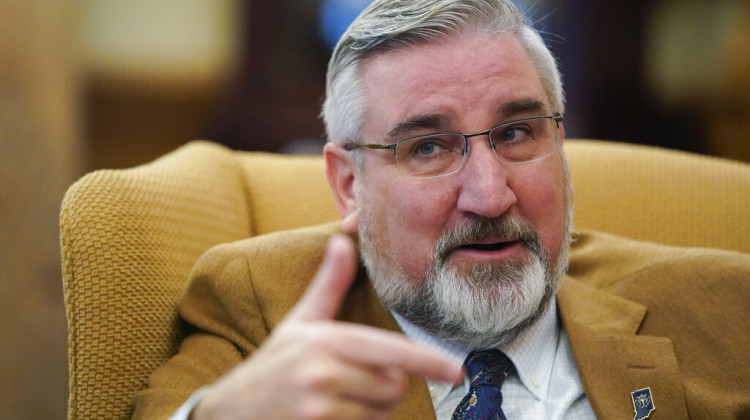 Indiana Gov. Eric Holcomb speaks during an interview at the Statehouse, Tuesday, Dec. 7, 2021, in Indianapolis. With Indiana's COVID-19 hospitalizations doubling in the past month amid the latest surge, Holcomb expressed frustration Tuesday with "absurd" reasons some have for refusing vaccinations although he isn't offering any new state actions to combat the virus spread. - AP Photo/Darron Cummings