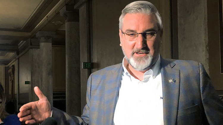 Indiana Gov. Eric Holcomb speaks with reporters at the Indiana Statehouse in Indianapolis on Wednesday, Feb. 23, 2022.  - AP Photo/Tom Davies