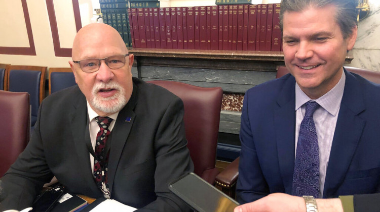 Indiana House Ways and Means Committee Chairman Tim Brown, R-Crawfordsville, left, talks with reporters alongside Senate Appropriations Committee Chairman Ryan Mishler, R-Bremen, on Monday, March 7, 2022, at the Indiana Statehouse in Indianapolis. Brown and Mishler are among lawmakers involved in negotiations over proposed individual income and business tax cuts as this year's legislative session is expected to adjourn later this week.  - (AP Photo/Tom Davies)