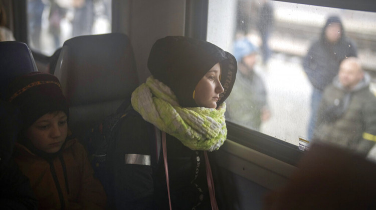 A girl and her brother sit on a train bound for Lviv at the Kyiv station, Ukraine, Thursday, March 3, 2022.  - AP Photo/Emilio Morenatti