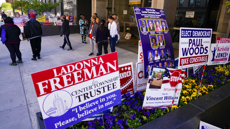 Electioneers greet voters as they enter the City-County Building to vote in the final hours of early voting in the primary election in Indianapolis, Monday, May 2, 2022. Indiana's primary election is Tuesday. - AP Photo/Michael Conroy