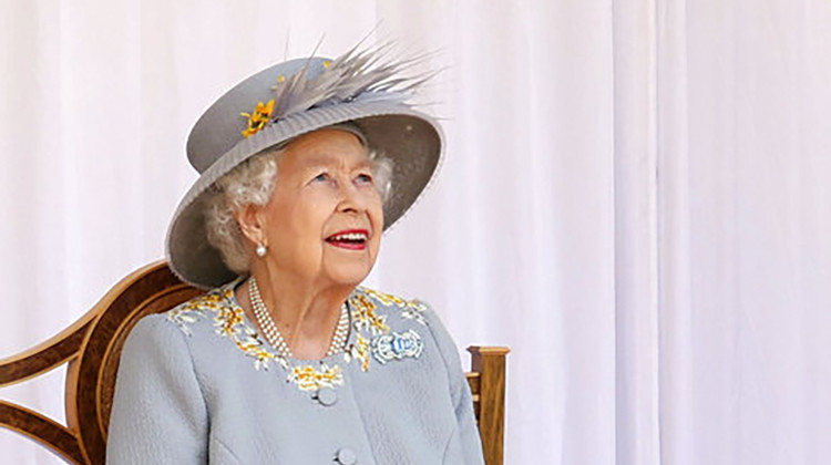 FILE - Britain's Queen Elizabeth II watches the red arrows fly over to mark her official birthday at Windsor Castle, Windsor, England, Saturday June 12, 2021. - Chris Jackson/Pool via AP, File