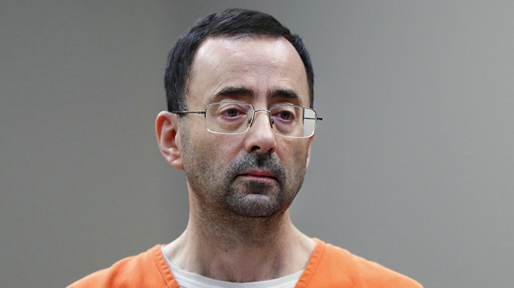 FILE - Dr. Larry Nassar, appears in court for a plea hearing on Nov. 22, 2017, in Lansing, Mich. The U.S. Justice Department said Thursday, May 26, 2022 it will not pursue criminal charges against former FBI agents who failed to quickly open an investigation of sports doctor Larry Nassar despite learning in 2015 that he was accused of sexually assaulting female gymnasts. - AP Photo/Paul Sancya File