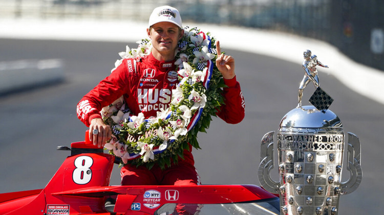 Marcus Ericsson, of Sweden, poses with the Borg-Warner Trophy during the traditional winners photo session at Indianapolis Motor Speedway in Indianapolis, Monday, May 30, 2022. Ericsson won the 106th running of the Indianapolis 500 auto race Sunday. - AP Photo/Michael Conroy