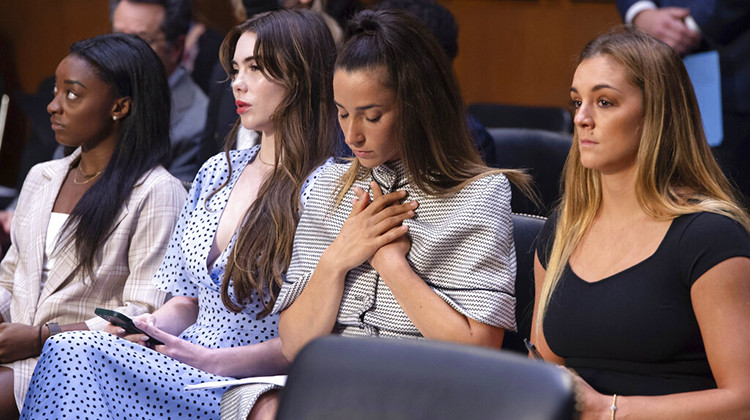 FILE - United States gymnasts from left, Simone Biles, McKayla Maroney, Aly Raisman and Maggie Nichols, arrive to testify during a Senate Judiciary hearing about the Inspector General's report on the FBI's handling of the Larry Nassar investigation on Capitol Hill, Wednesday, Sept. 15, 2021, in Washington.  - Saul Loeb/Pool via AP, File