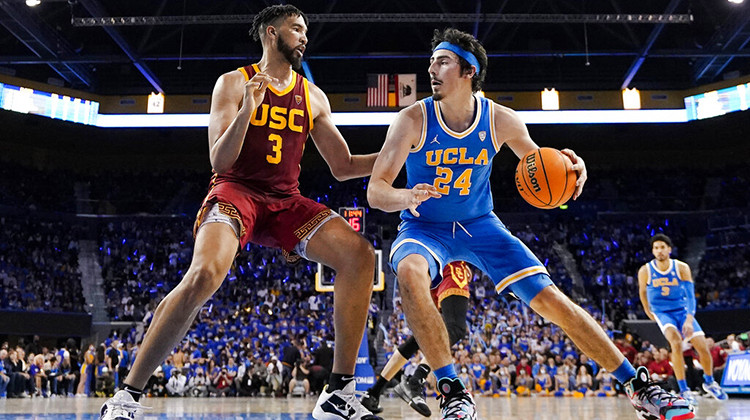 FILE - UCLA guard Jaime Jaquez Jr., right, tries to get by Southern California forward Isaiah Mobley during the second half of an NCAA college basketball game on March 5, 2022, in Los Angeles.  - AP Photo/Mark J. Terrill, File