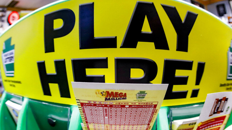 FILE - A Mega Millions playslip for those players preferring to choose the numbers they want to play is among the stacks of other lottery game playslips displayed at a Smoker Friendly store in Cranberry Township, Pa., Friday, Jan. 22, 2021.  - AP Photo/Keith Srakocic, File