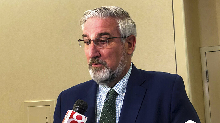 Indiana Gov. Eric Holcomb speaks with reporters after an Indiana Black Expo event at the Indiana Convention Center in Indianapolis, Tuesday, July 12, 2022. Holcomb sidestepped taking a stance on how far the Republican-dominated Legislature should go in further restricting abortions in the state when lawmakers begin a special session on July 25. - AP Photo/Tom Davies