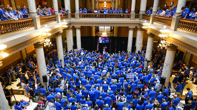 FILE - Anti-abortion supporters rally as the Indiana Senate Rules Committee met to consider a Republican proposal to ban nearly all abortions in the state during a hearing at the Statehouse in Indianapolis, July 26, 2022. The debate over a limited set of circumstances in which abortion could be legal is causing divisions among GOP lawmakers in some states.  - AP Photo/Michael Conroy, File