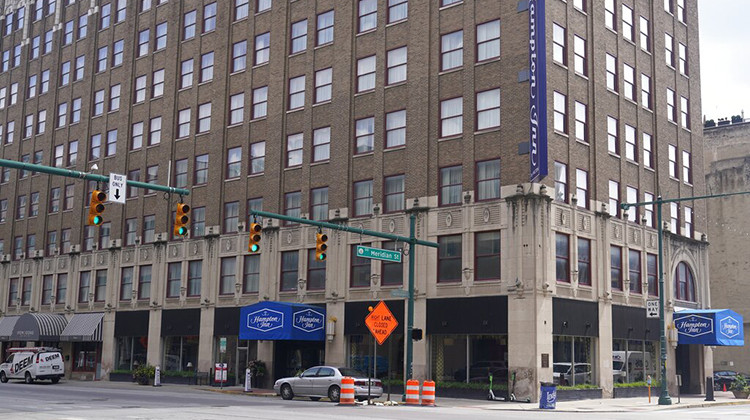 The Hampton Inn photographed, Monday, Aug. 29, 2022, in Indianapolis. Three members of the Dutch Commando Corps, who were training at a center, were shot outside of the hotel in downtown Indianapolis early Saturday morning. The Dutch Defense Ministry says that one has died.  - AP Photo/Darron Cummings