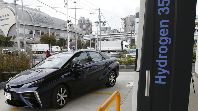 FILE - A Toyota Motor Corp.'s new hydrogen fuel cell vehicle Mirai arrives at a charge station near Toyota's showroom on Nov. 17, 2014, in Tokyo. Seven Midwestern states are teaming up to accelerate the development of hydrogen as a clean-energy alternative for automobiles and factories that rely largely on climate-warming fossil fuels, governors said Monday, Sept. 19, 2022. - AP Photo/Shizuo Kambayashi, File