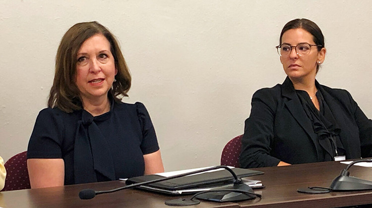 ndiana state Treasurer Kelly Mitchell, left, speaks during a news conference at the Indiana Statehouse in Indianapolis, on July 14, 2022. A judge has thrown out a lawsuit claiming that Mitchell violated state law by awarding contracts worth more than $6 million to firms linked to her political supporters. - AP Photo/Tom Davies