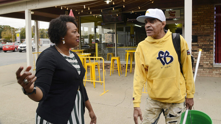 Jennifer-Ruth Green, the Republican candidate for Indiana's 1st Congressional District and an U.S. Air Force veteran left, talks with window washer James Brown, right before a roundtable meeting Thursday, Oct. 20, 2022, in Gary, Ind.  - AP Photo/Paul Beaty