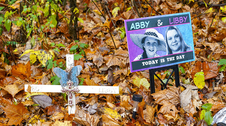 FILE - A makeshift memorial to Liberty German and Abigail Williams near where they were last seen and where the bodies were discovered stands along the Monon Trail leading to the Monon High Bridge Trail in Delphi, Ind., Oct. 31, 2022. An Indiana judge could rule Tuesday, Nov. 22, 2022, if sealed court documents with evidence that led to a man’s arrest in the 2017 slayings of the two teenage girls will be publicly released. - AP Photo/Michael Conroy, File