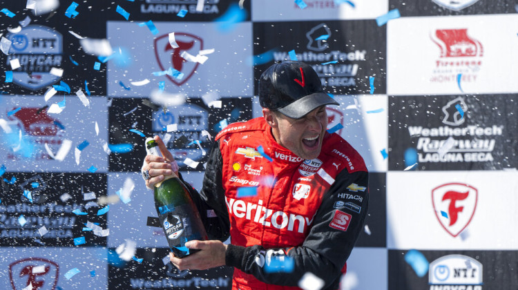 Team Penske driver Will Power, of Australia, celebrates after winning third place in the IndyCar season finale auto race at Laguna Seca Raceway on Sept. 11, 2022, Monterey, Calif. IndyCar has landed its own “Drive to Survive” type docudrama that will showcase the buildup to next year's Indianapolis 500. The six-part “100 Days to Indy” will air on The CW Network next spring and chronicle the 100-day window ahead of the “Greatest Spectacle in Racing” on May - AP Photo/Nic Coury, File