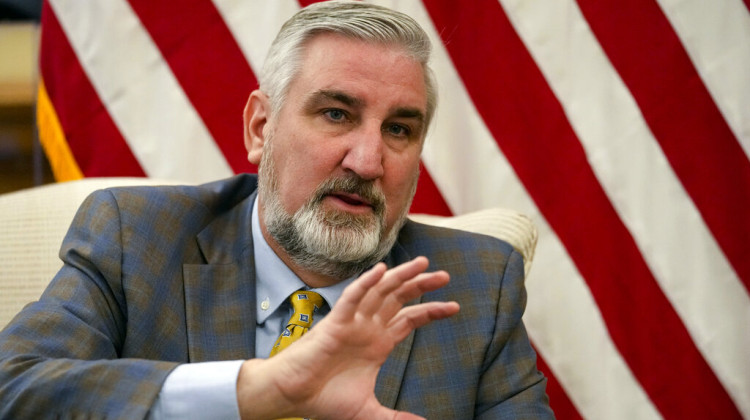 Indiana Gov. Eric Holcomb, gestures as he answers a question during an interview in his Statehouse office in Indianapolis, Thursday, Dec. 15, 2022. Holcomb is entering his final two years in office, with several candidates already lining up to take over his Statehouse desk as term limits prevent him from seeking reelection again. - AP Photo/Michael Conroy