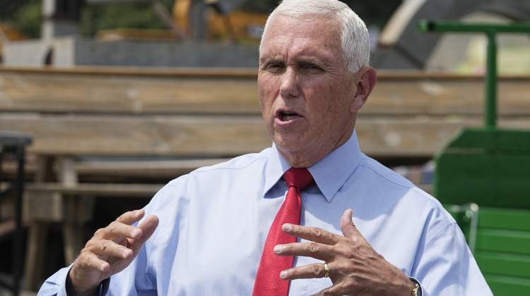 FILE - Republican presidential candidate and former Vice President Mike Pence speaks with the media during a stop at the Indiana State Fair, Aug. 2, 2023, in Indianapolis. Pence announced Tuesday he has qualified for the first Republican debate of the 2024 presidential cycle, securing the required number of donors with just two weeks until candidates gather in Milwaukee.  - AP Photo/Darron Cummings, File