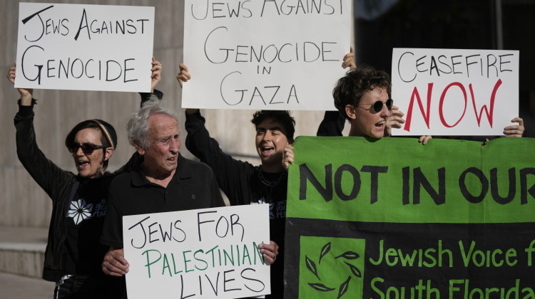 Members of South Florida Jewish Voice for Peace and other protesters call for a ceasefire in Gaza, outside the Miami office of Sen. Rick Scott, Tuesday, Oct. 17, 2023, in Coral Gables, Fla. More than 50 people from several faiths joined the protest calling on Sen. Scott and other politicians to support "an immediate ceasefire, humanitarian aid to Gaza, now, [and] an end to Israeli's illegal occupation of Palestine." - (AP Photo/Rebecca Blackwell)