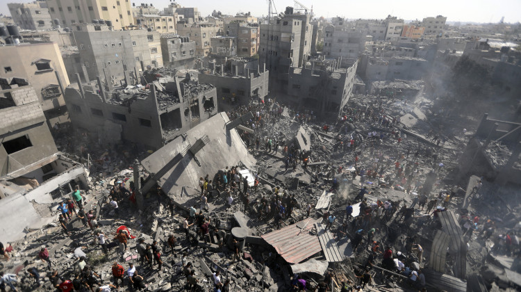 Palestinians inspect the rubble of destroyed buildings following Israeli airstrikes on town of Khan Younis, southern Gaza Strip, Thursday, Oct. 26, 2023.  - (AP Photo/Mohammed Dahman)