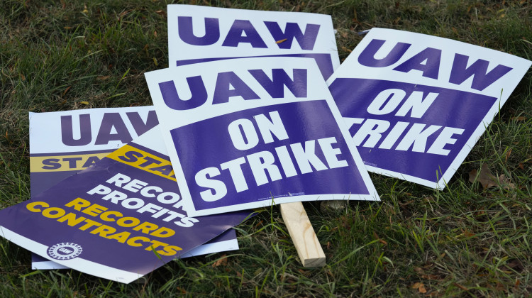 FILE - United Auto Workers signs for a strike are shown at the Stellantis Sterling Heights Assembly Plant, in Sterling Heights, Mich., Monday, Oct. 23, 2023. Jeep maker Stellantis has reached a tentative contract agreement with the United Auto Workers union that follows a template set earlier this week by Ford, two people with knowledge of the negotiations said Saturday, Oct. 28, 2023. - AP Photo/Paul Sancya, File