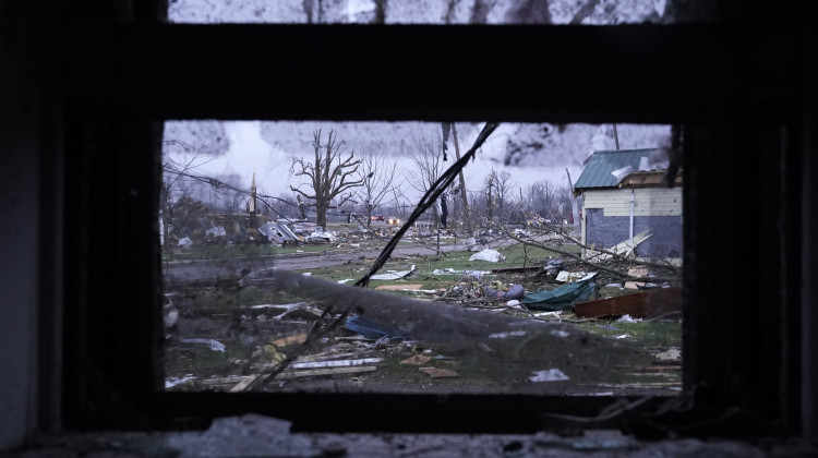 Debris is visible through the window of a damaged home following severe storms Friday, March 15, 2024, in Lakeview, Ohio. - Joshua A. Bickel / AP Photo