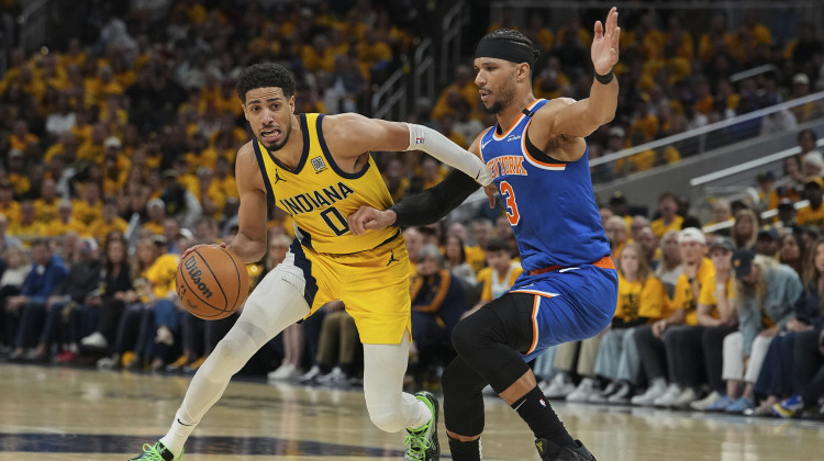 Indiana Pacers guard Tyrese Haliburton (0) dribbles the ball past New York Knicks guard Josh Hart (3) during the first half of Game 4 of the Eastern Conference finals of the NBA basketball playoffs in Indianapolis, Tuesday, May 27, 2025. - Michael Conroy / AP Photo