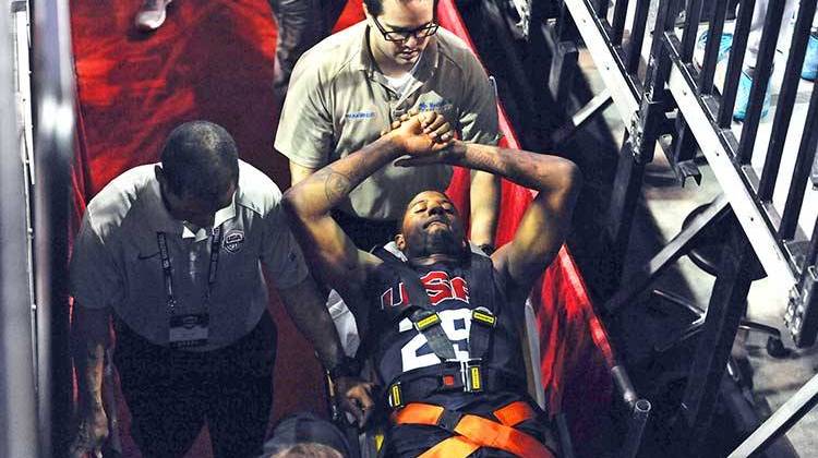 In this photo provided by the Las Vegas News Bureau, Indiana Pacers' Paul George is carted off the court after breaking his right leg during the USA Basketball Showcase intrasquad game in Las Vegas on Friday, Aug. 1. - AP Photo/Las Vegas News Bureau, Glenn Pinkerton